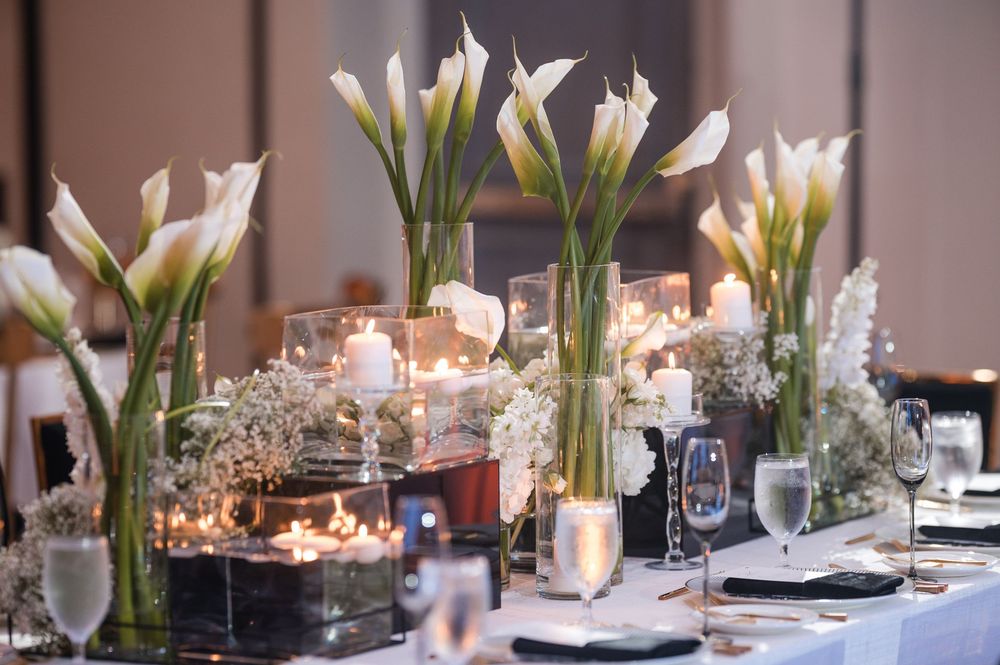 Reception table details with candles and floral arrangements at wedding in Puerto Rico