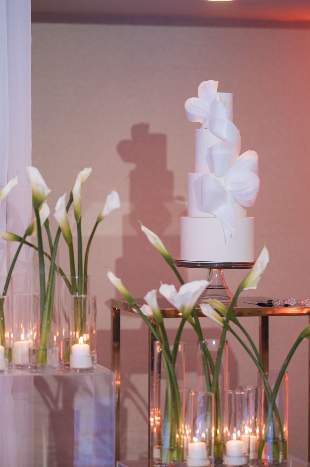 Wedding cake display at reception in Puerto Rico with elegant decor