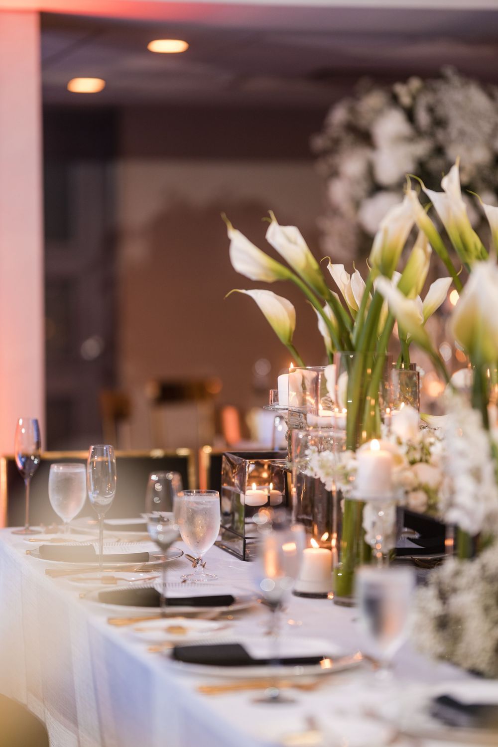 Elegant wedding table setup with floral centerpieces during reception in Puerto Rico