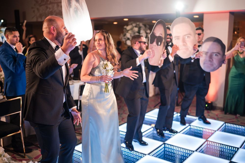 Guests surrounding bride during bouquet toss at Royal Sonesta San Juan wedding reception