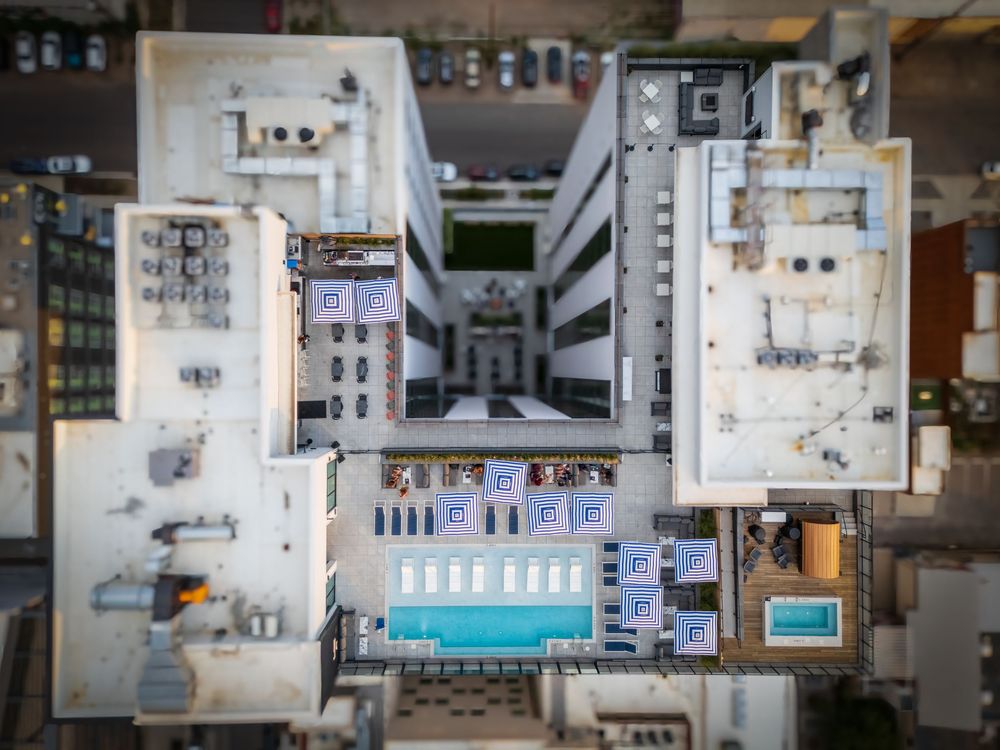 Top down aerial/drone shot of Rose & Thorn's rooftop pool by Denver Hospitality, Travel & Tourism photographer Captain Colorado Photography.