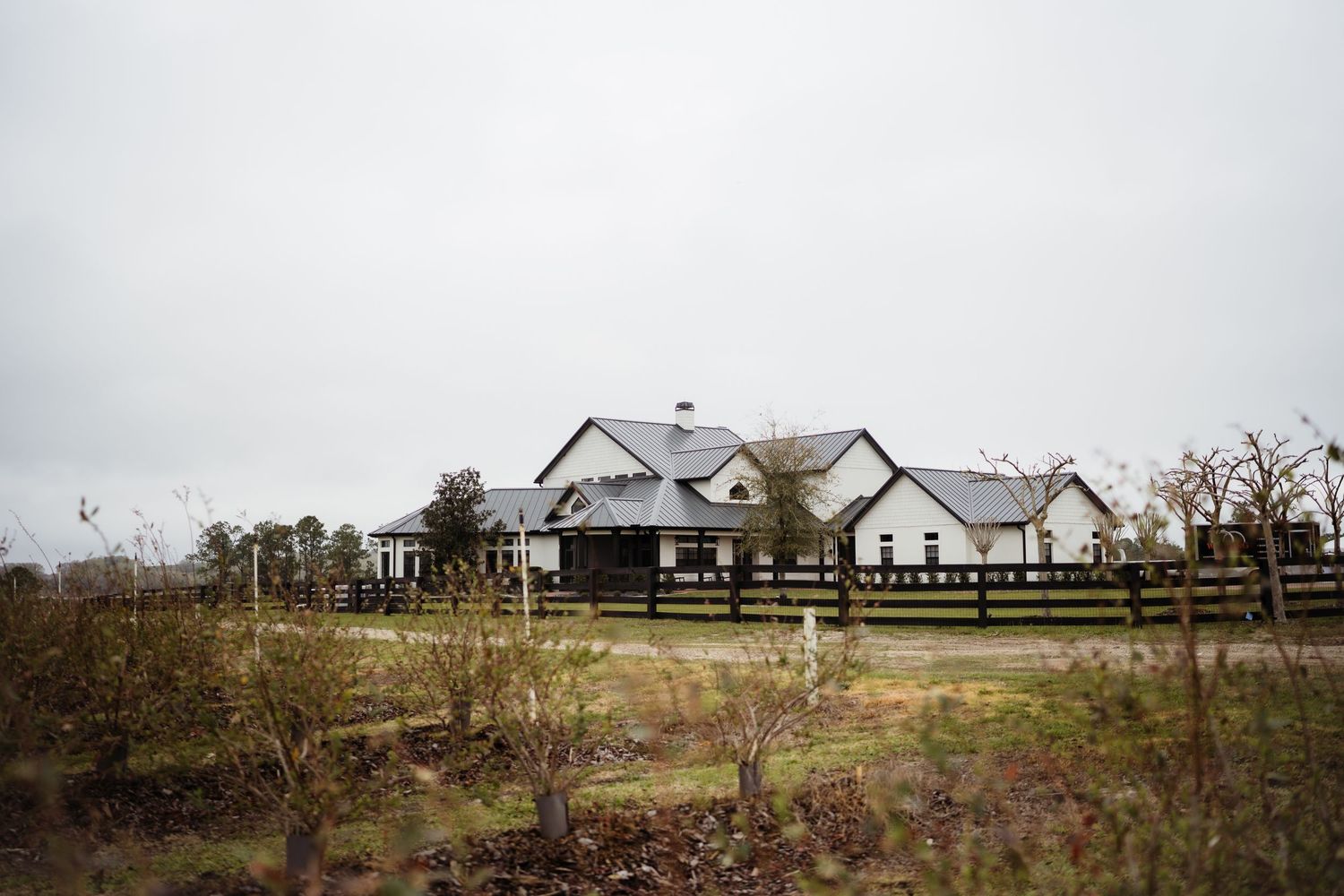 A series of panoramic rural landscape photos showing farmhouses and barns in misty weather conditions.