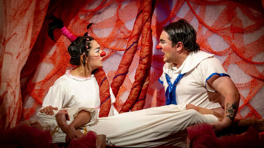 A collage of dance moves in front of a red and white swirled backdrop shows energetic partner dancing.