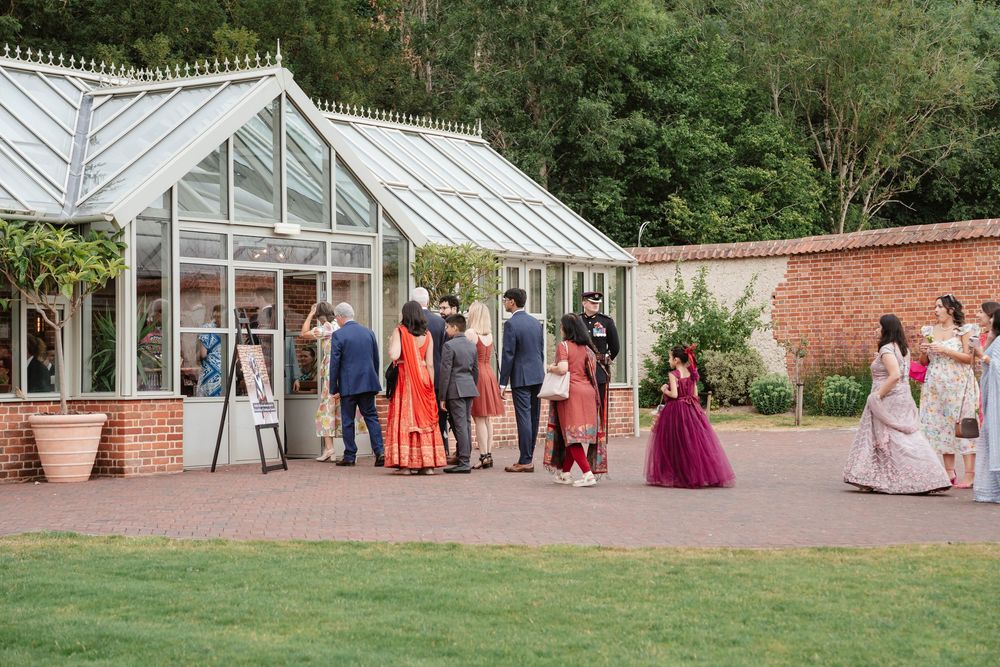 Syrencot House wedding venue Wiltshire Georgian manor guests arriving into the glasshouse