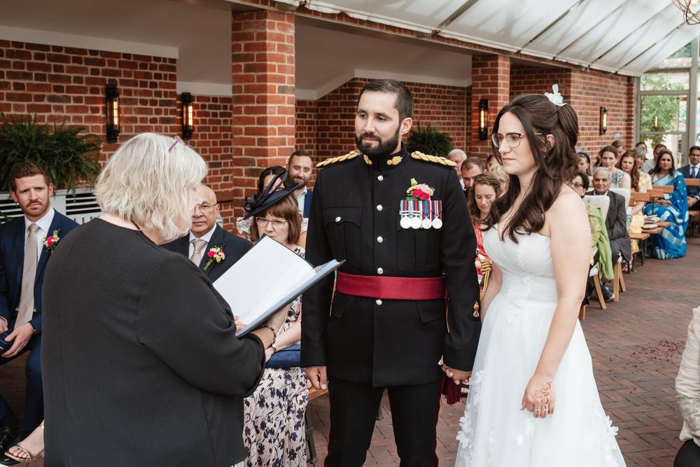 Syrencot House wedding venue Wiltshire Georgian manor during the ceremony in the glasshouse with registrar