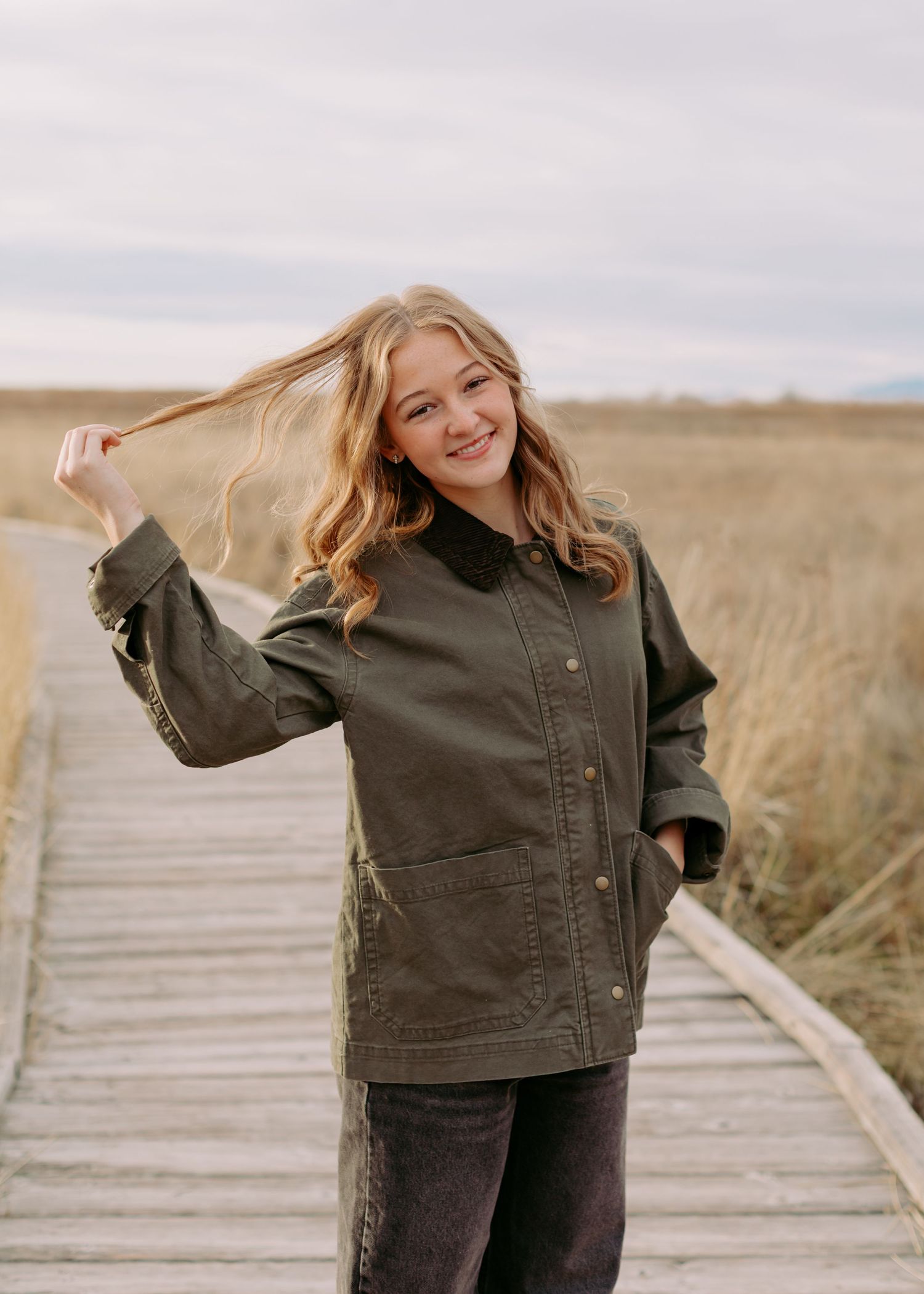 Senior photo session in Utah in a fun field.