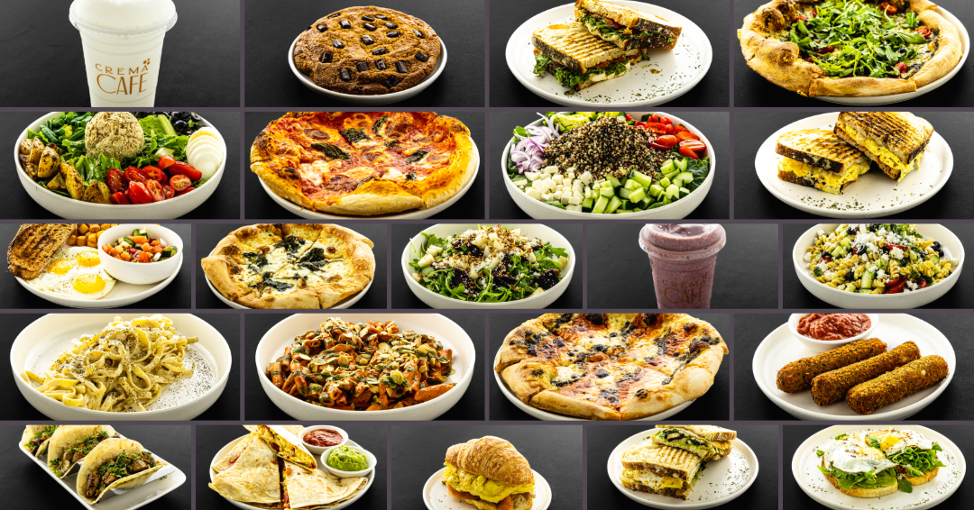 A diverse spread of international dishes including pizzas, salads, sandwiches and appetizers arranged on a dark surface.