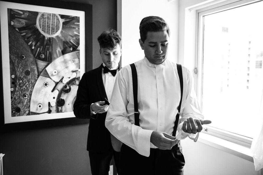 Black and white photo series showing people in an office setting looking at phones and computers.