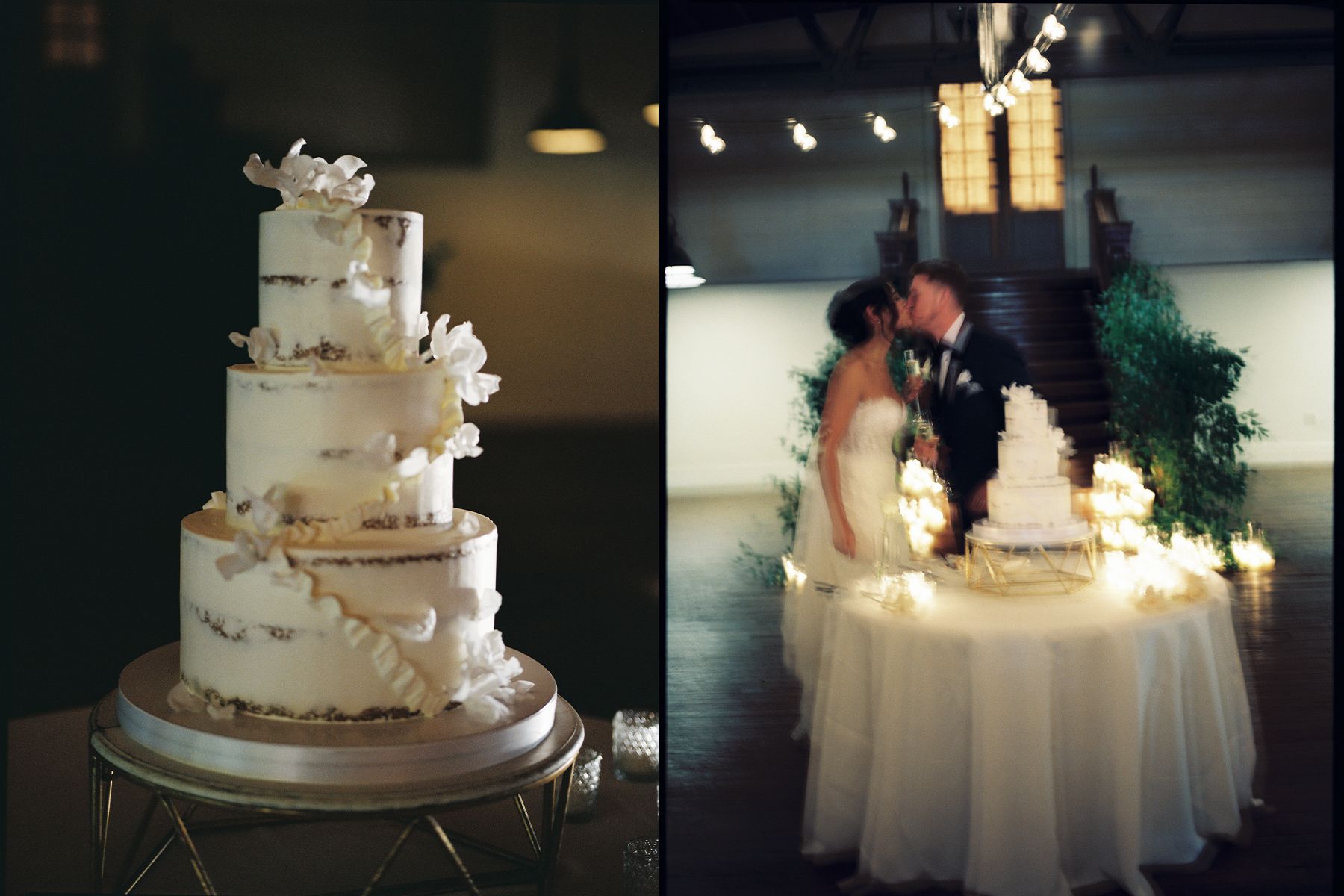 An elegant white wedding cake displayed on a table with ambient lighting.