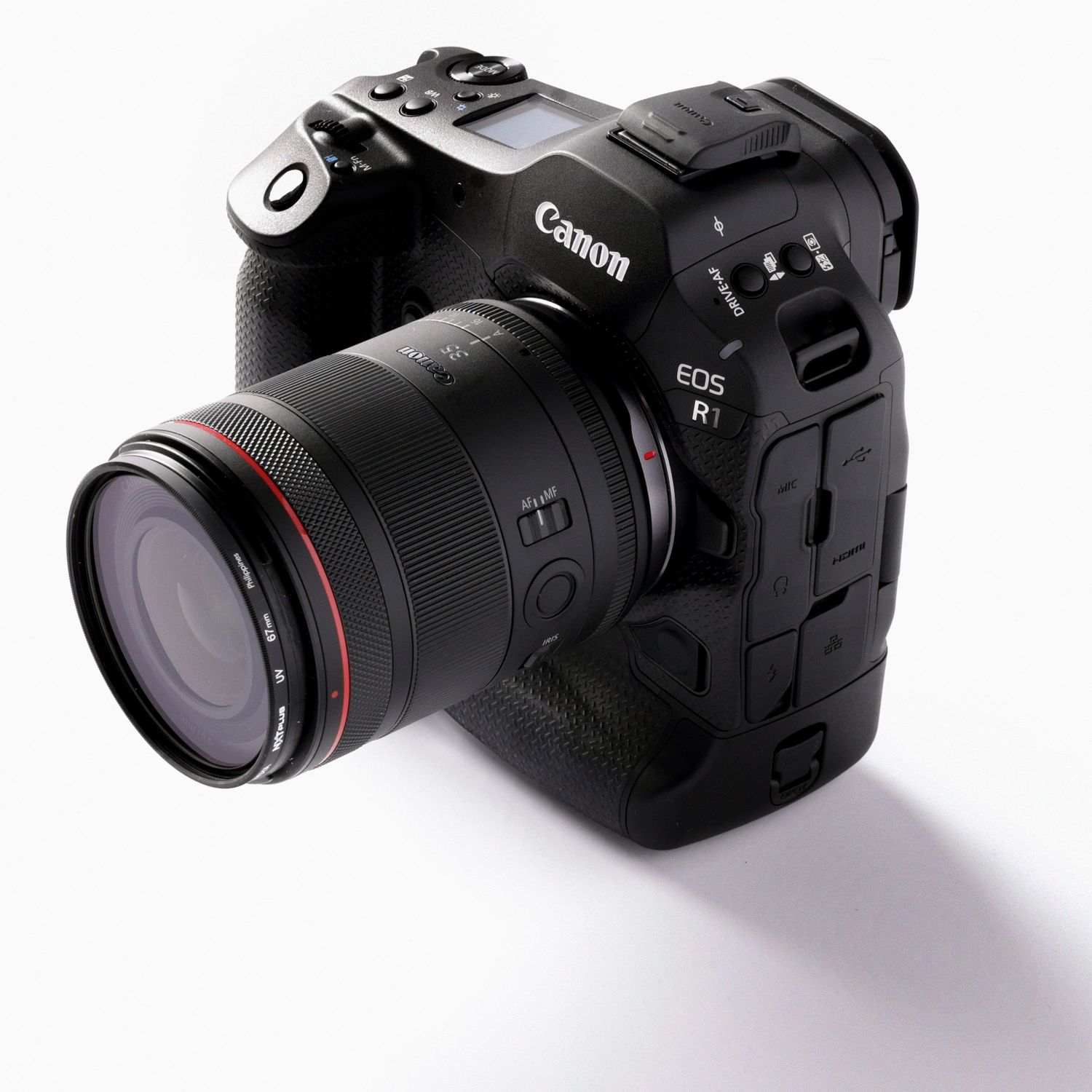 Canon EOS R1 camera with lens photographed on a white studio background.