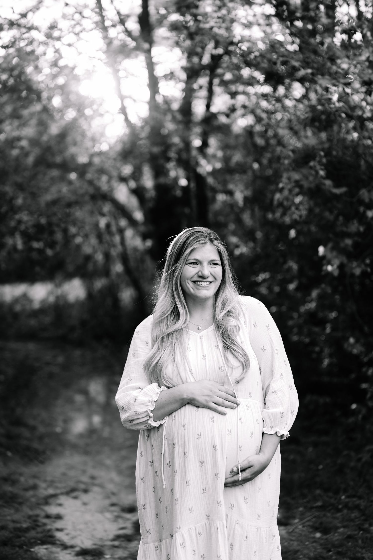 Pregnant wife with husband at a Marietta park maternity session