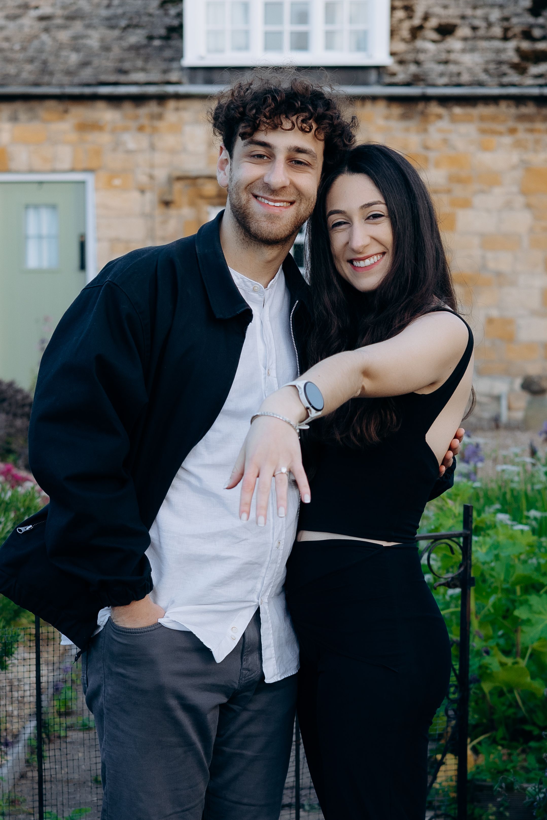 Romantic proposal in Broadway captured during golden hour.