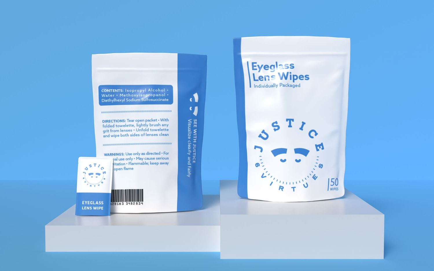 Two white pouches of Justice Virtues Eyeglass Lens Wipes displayed on pedestals against a blue background.