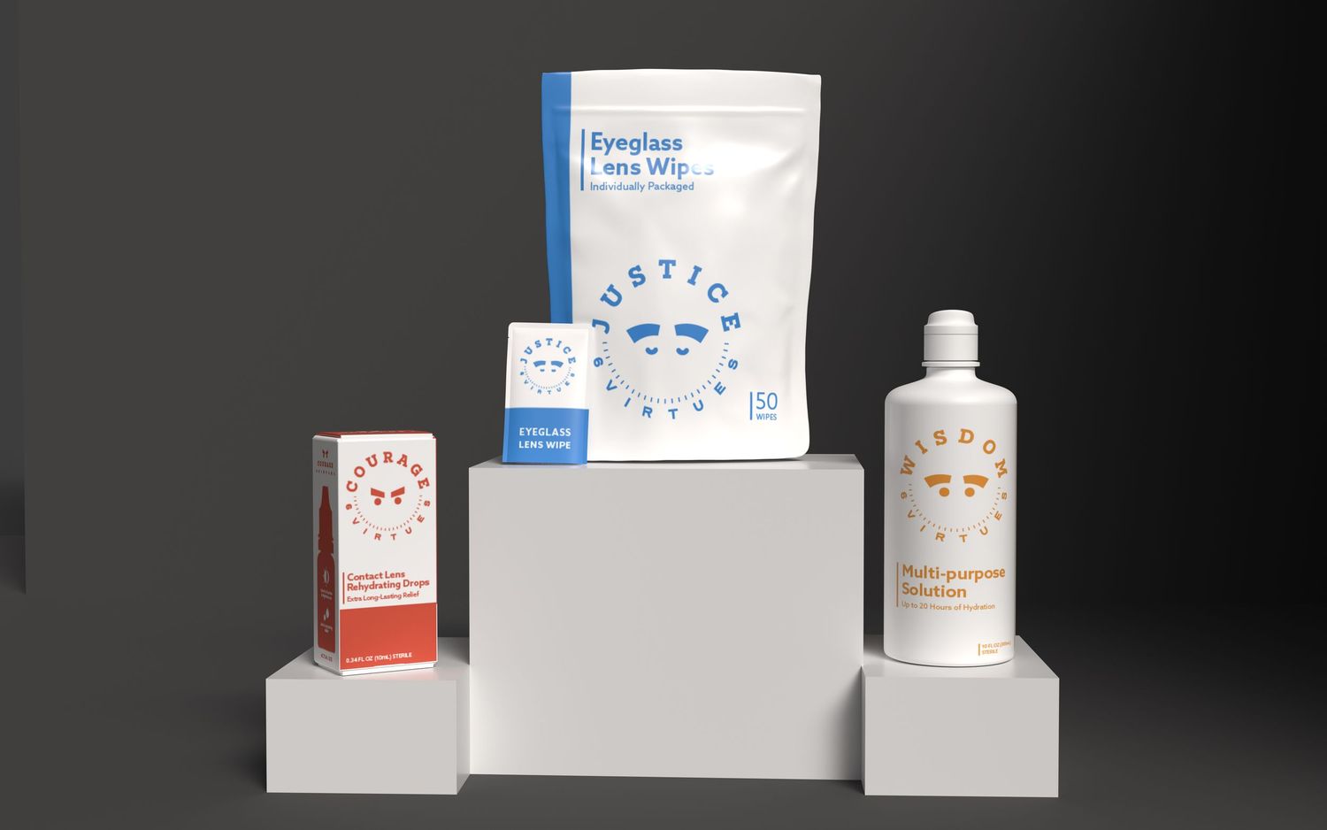 Justice branded eyeglass lens wipes, eye drops, and contact solution bottle arranged on white display stands.