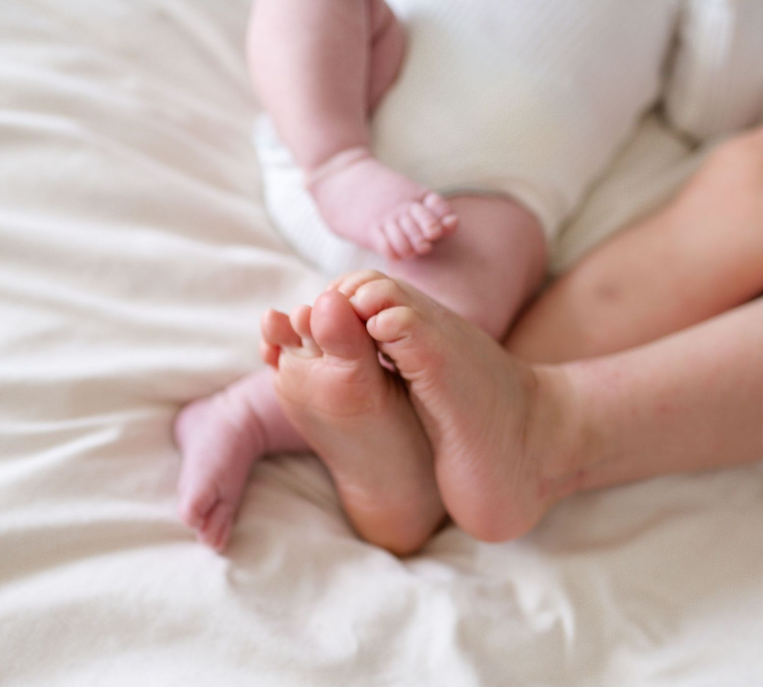 detail shot of children feet during lifestyle newborn photography session st louis