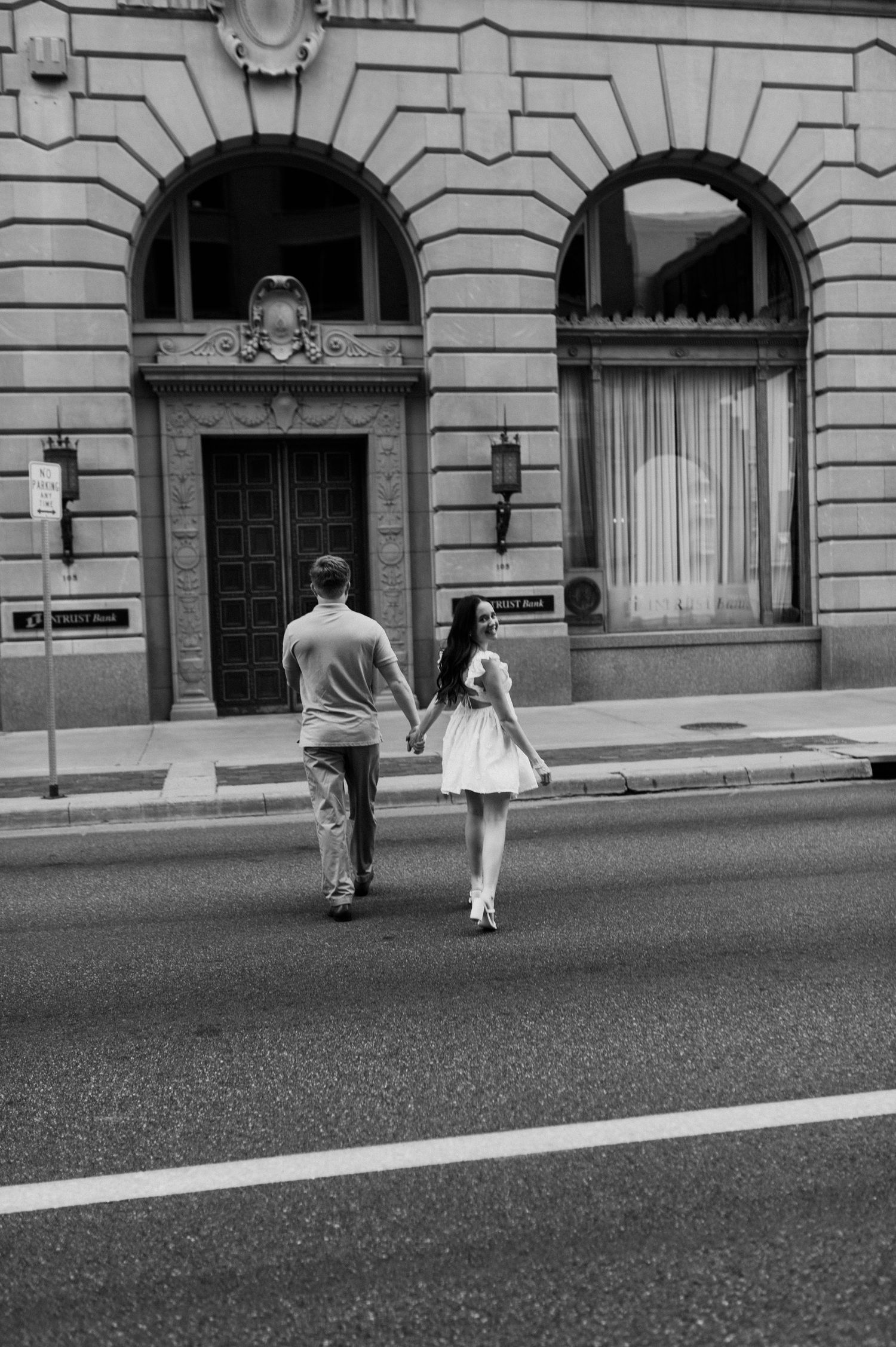 Downtown Wichita, KS engagement session by photographer Jessica Nadine Photography. Fancy classic architecture buildings city vibe
