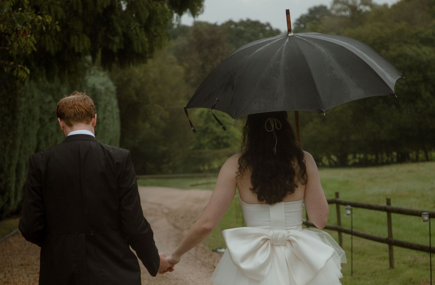 wedding day celebrations bride and groom umbrella wedding dress bow September wedding candid wedding photography