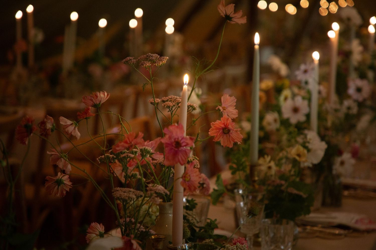 wedding tables wedding breakfast tables lights wild flowers photography details