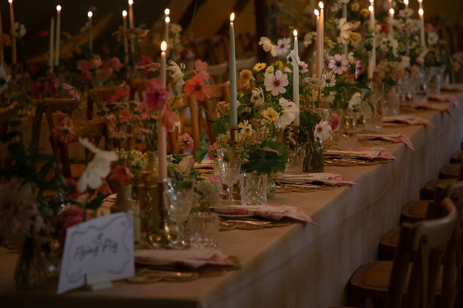 wedding breakfast table candles lights wild flowers table names table arrangements wedding photography