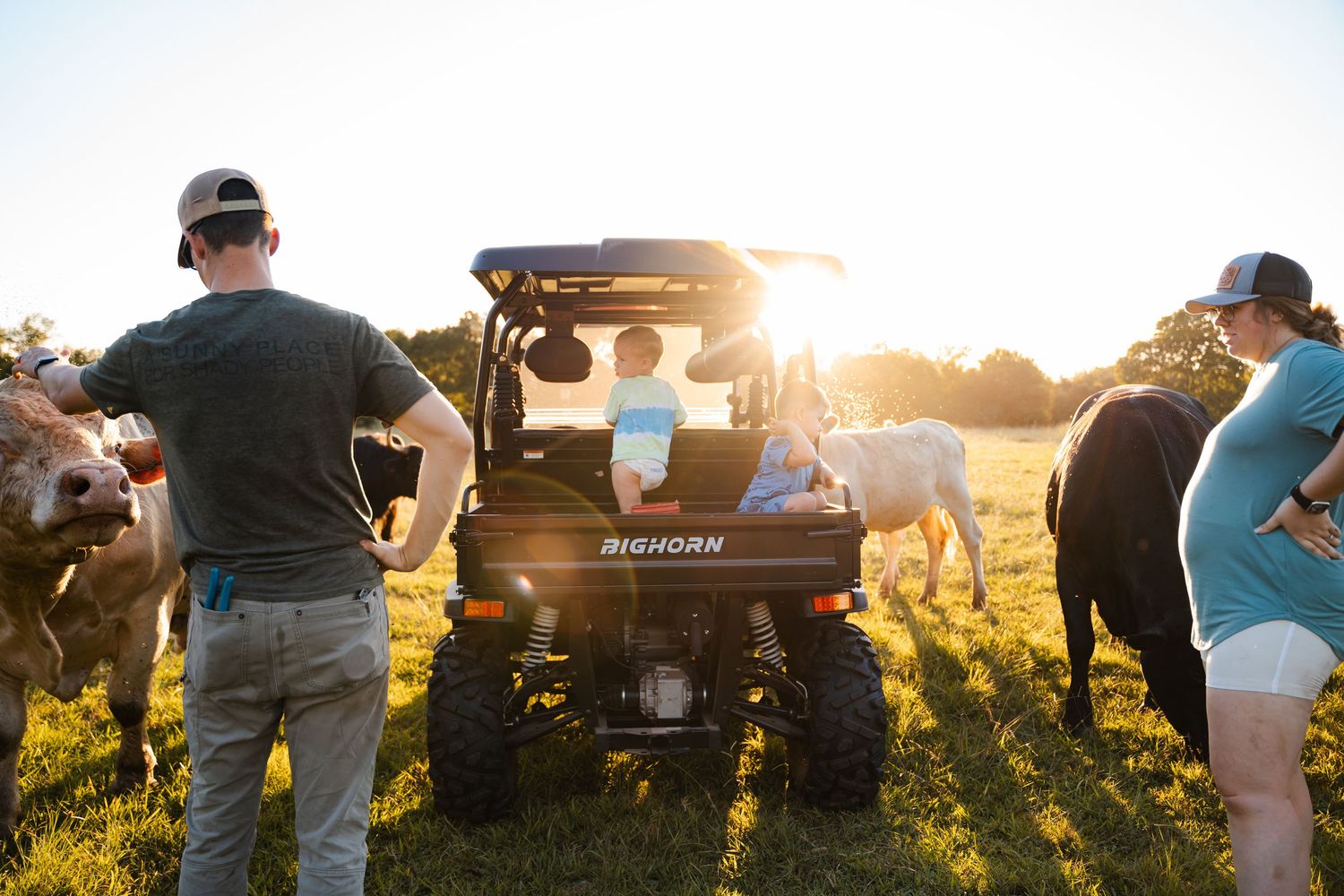 Oklahoma documentary family photography session in golden light with cows in the background, by Tulsa photographer