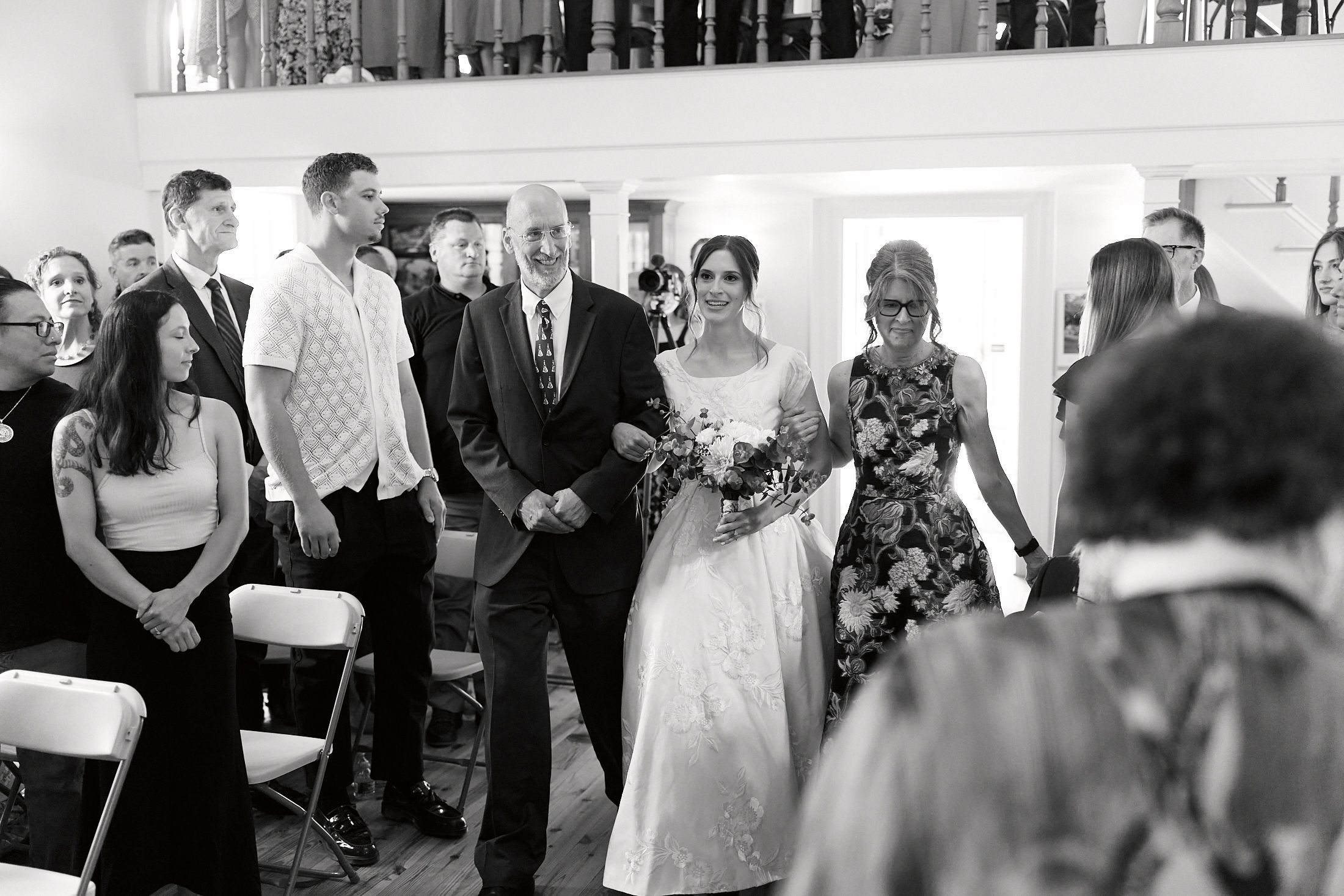 Black and white collage of wedding reception moments showing dancing, celebration and joyful interactions between guests.