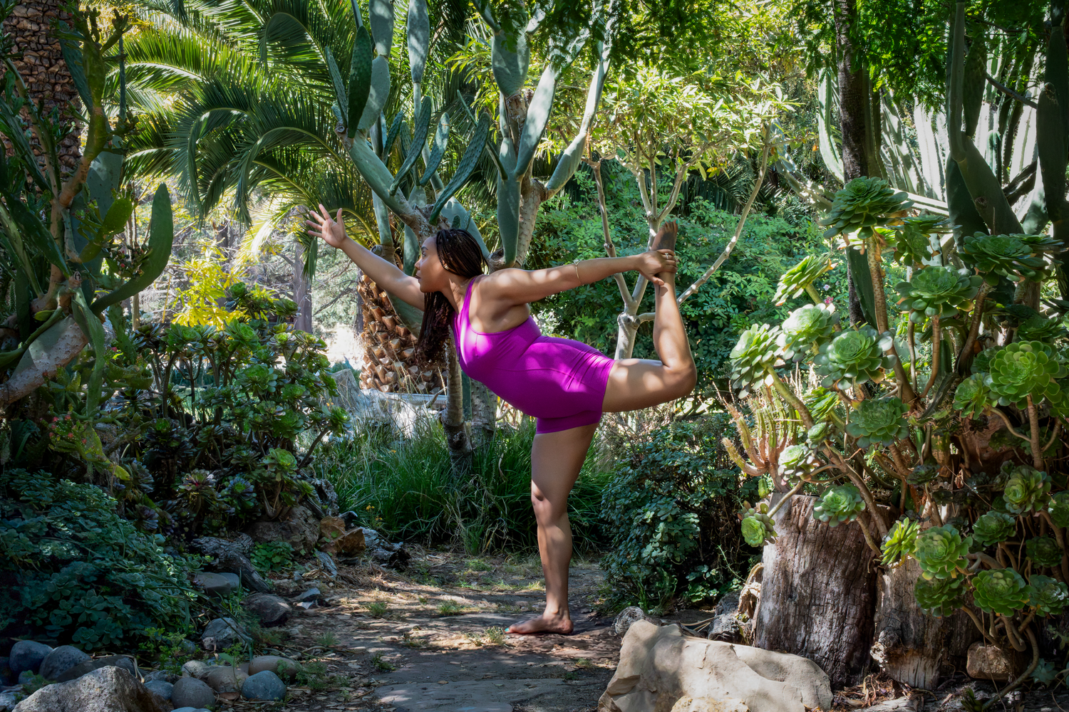 Artistic movement captured among tropical plants and natural forest elements.