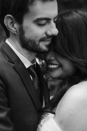 Close-up black and white portrait series of a romantic couple on their wedding day sharing intimate moments together.