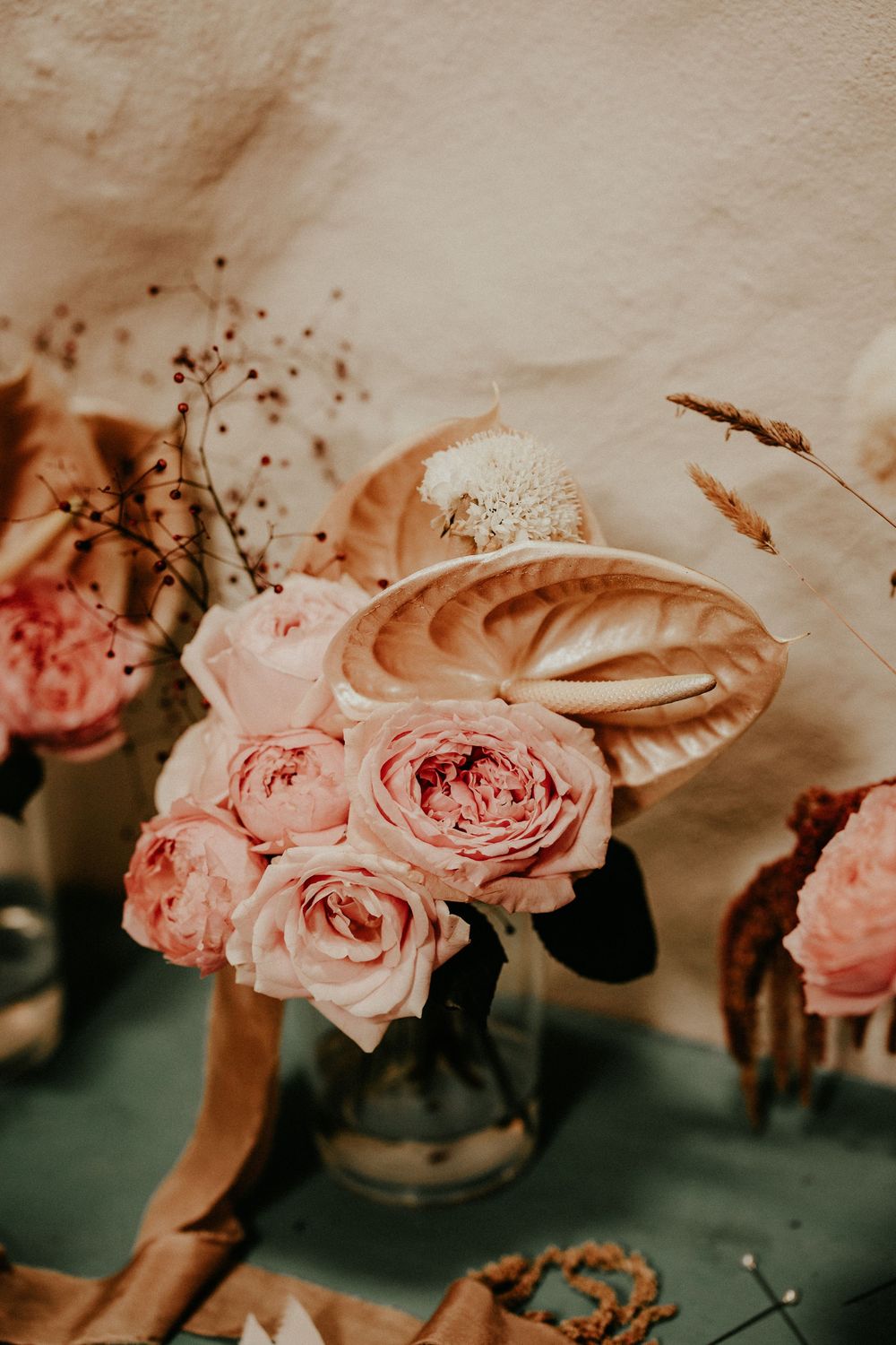 Romantic pink roses photographed in a vintage-inspired collage style with soft tones and shallow depth of field.