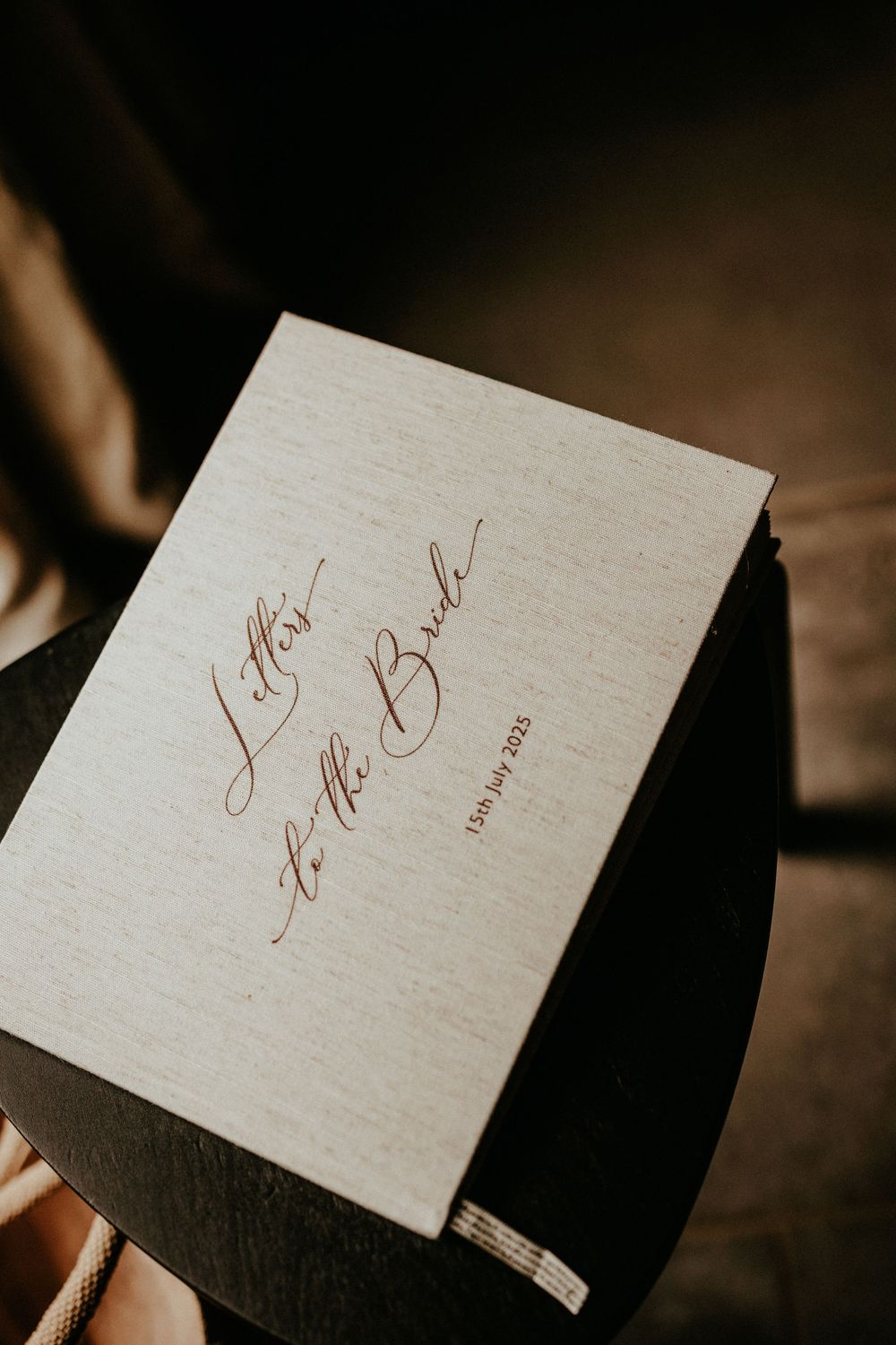 Elegant calligraphy text written in brown ink on cream-colored paper cards in various positions.