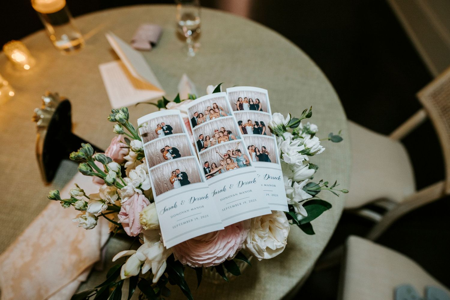 White floral wedding table cards displayed alongside elegant decor.