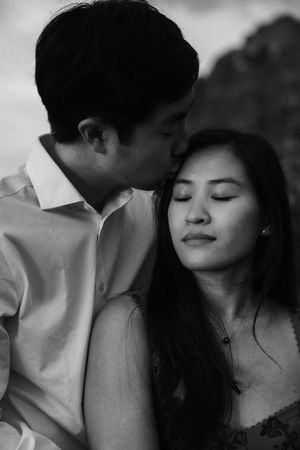 Black and white photo series of a tender romantic moment between two people showing affection and intimacy.