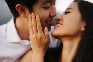 Romantic couple sharing intimate moments against soft lighting in multiple poses.