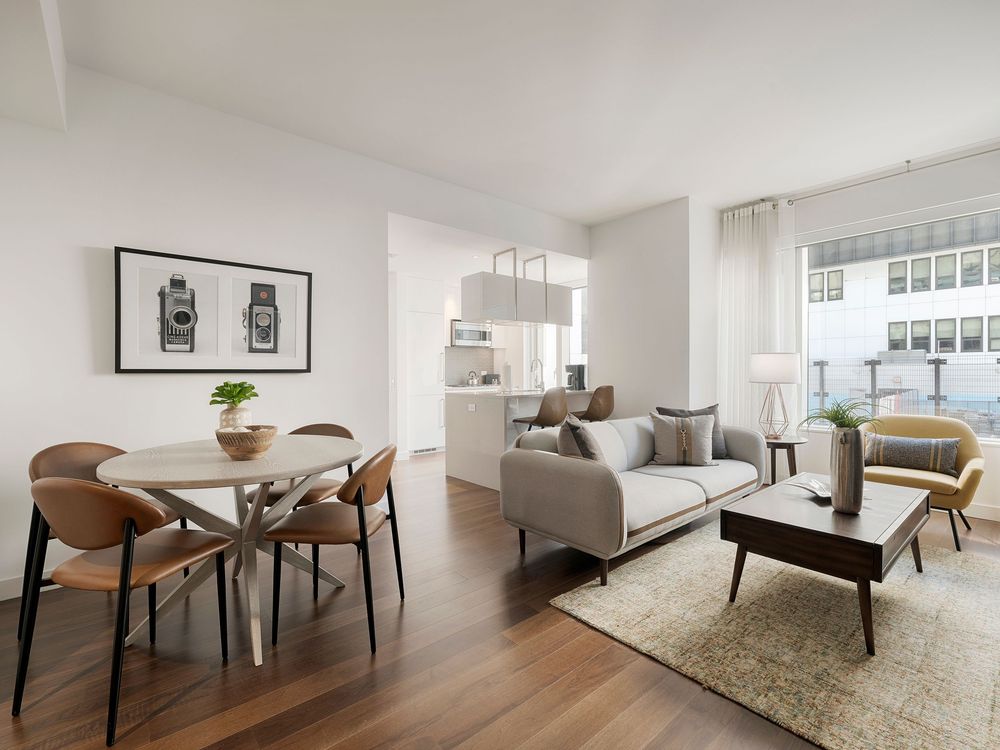 Modern minimalist rental apartment interior featuring white and wood finishes with open concept living and dining areas.