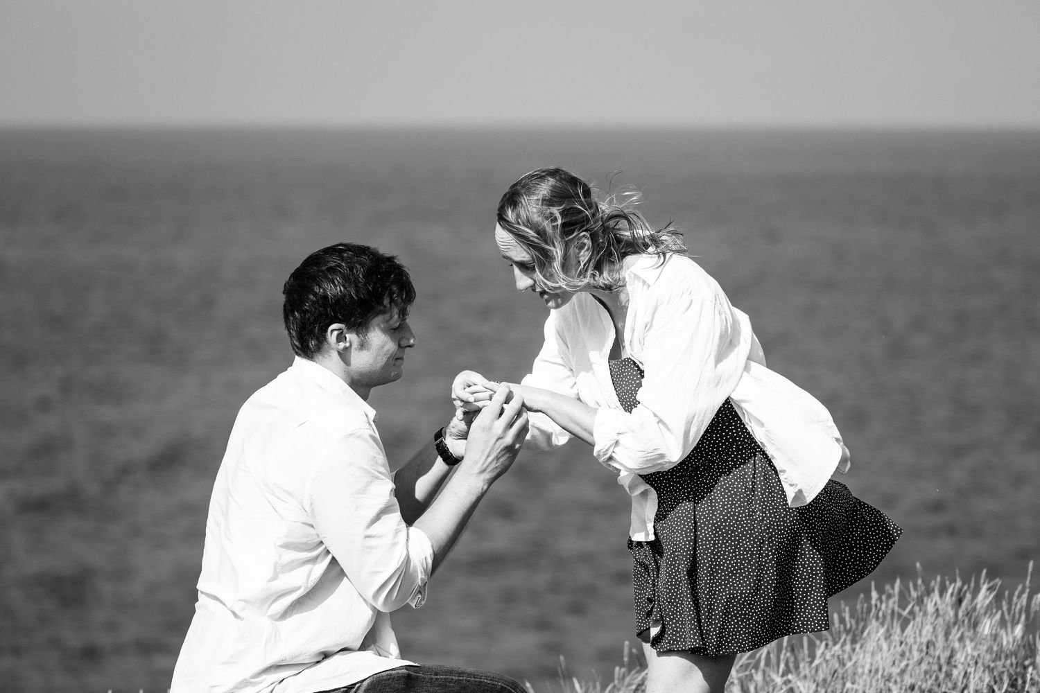 Romantic marriage proposal by the Atlantic ocean, at São Miguel island, Azores.