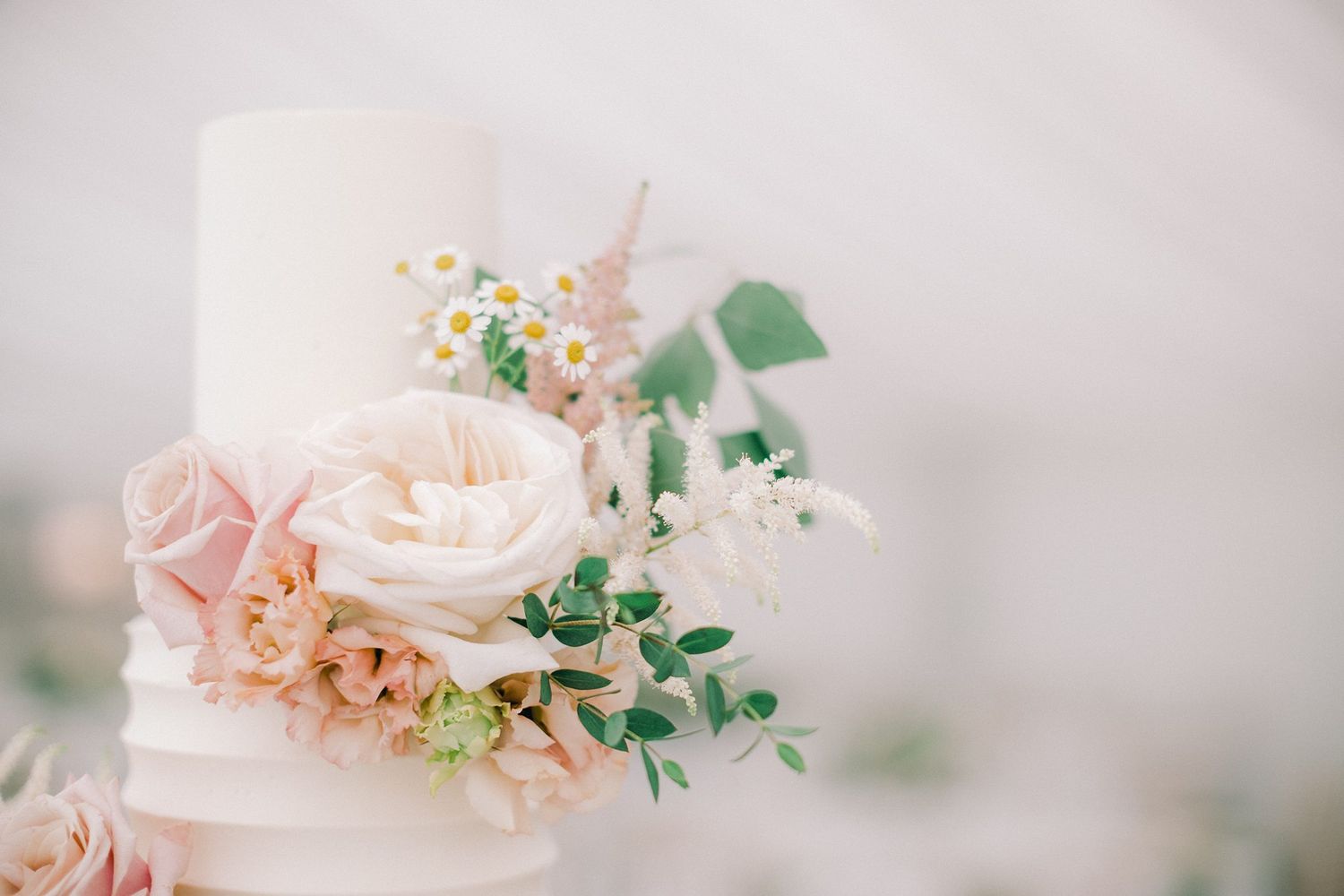 Close-up of an elegant white wedding cake at Fox Harb'r resort, Nova Scotia