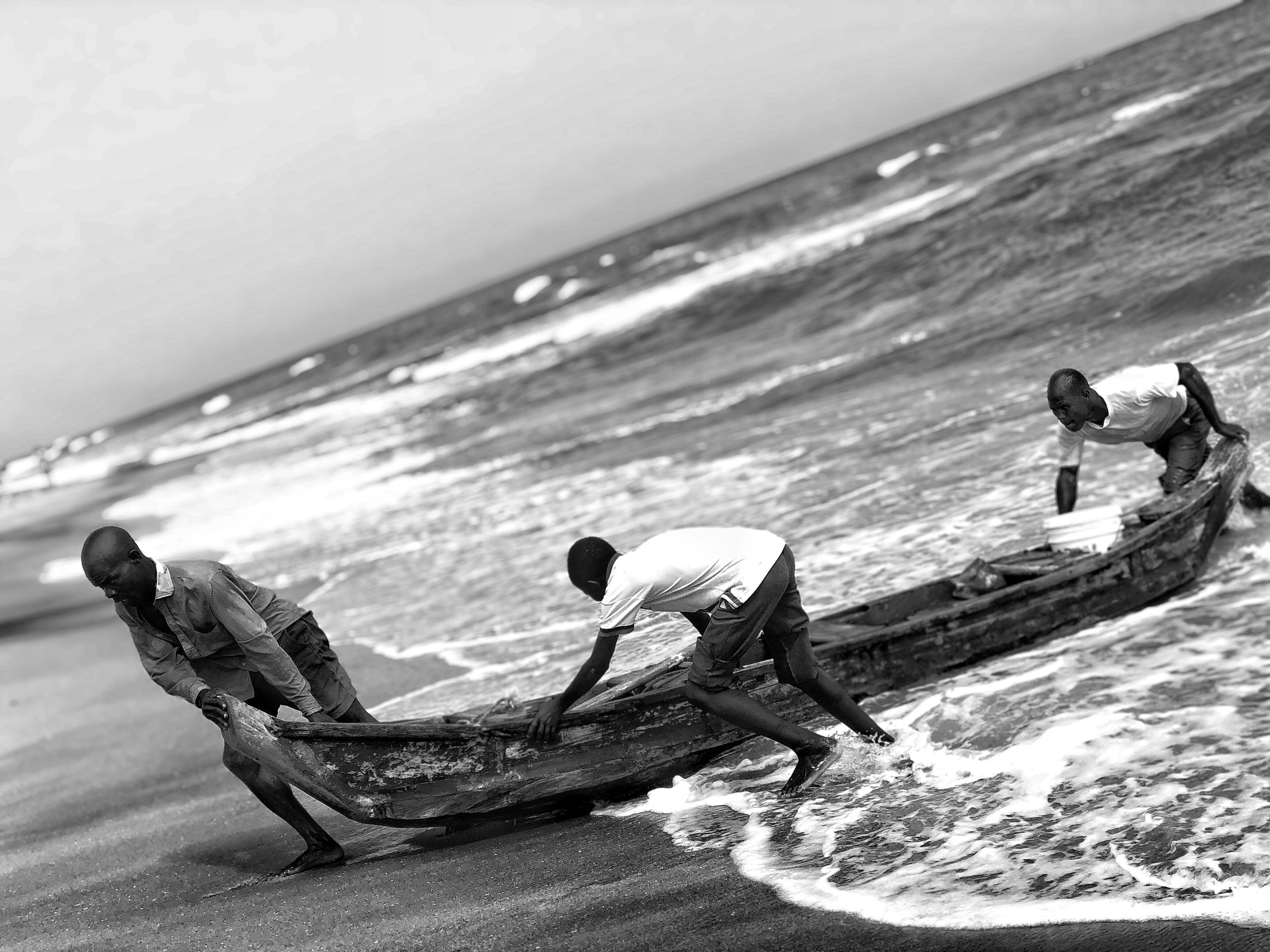 three fisherman in action at Prampram captured by Dennis Fofie