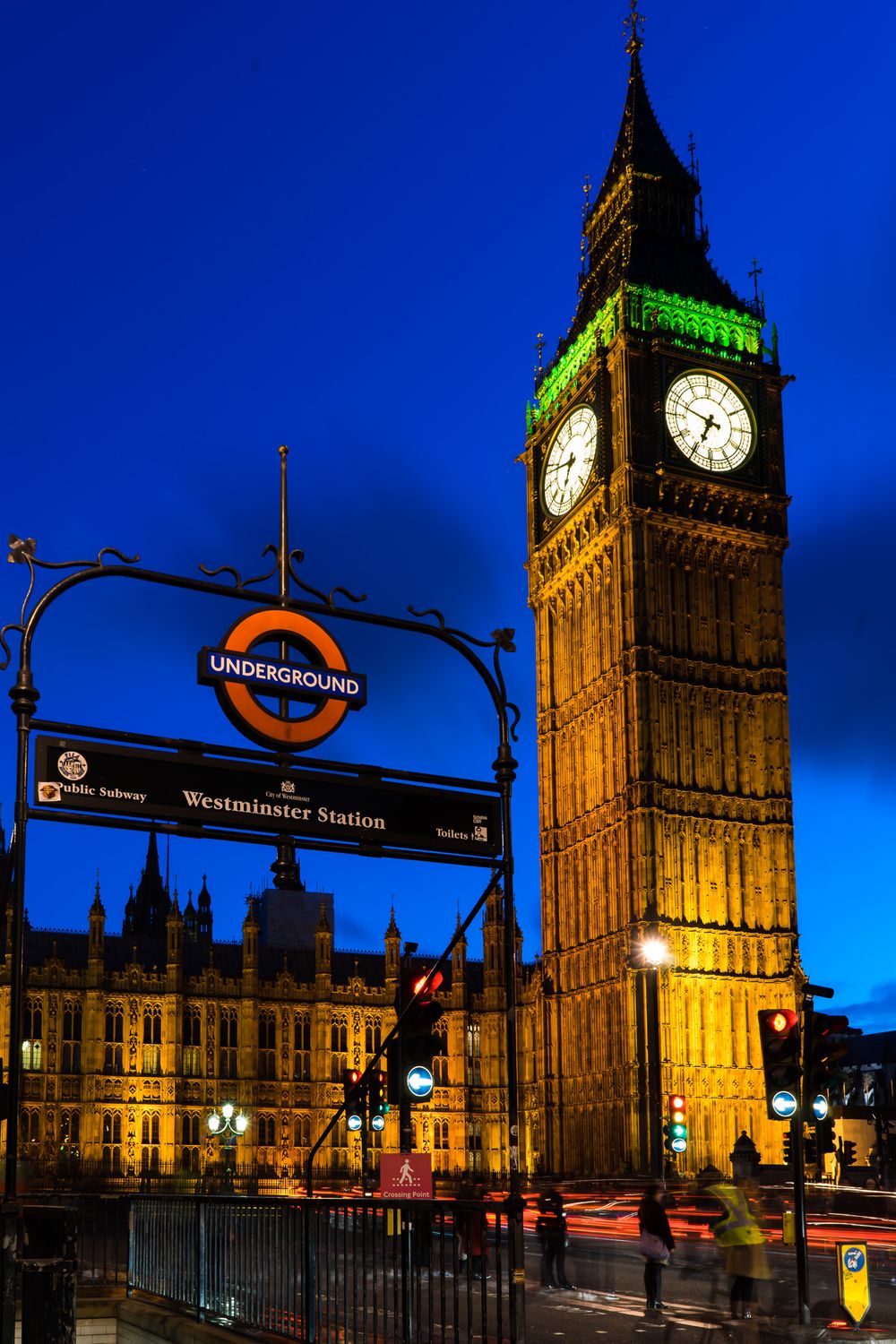 Multiple views of London's iconic Big Ben and Westminster station at night with illuminated signs and clock tower.
