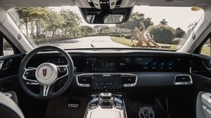 Modern car interior dashboard showing sleek digital displays and controls in a luxury vehicle.