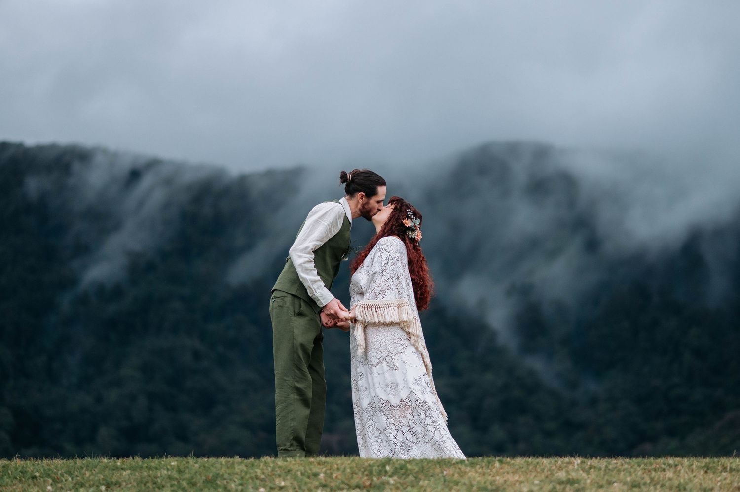 A couple embraces in misty mountain scenery during their wedding photo shoot across multiple frames.