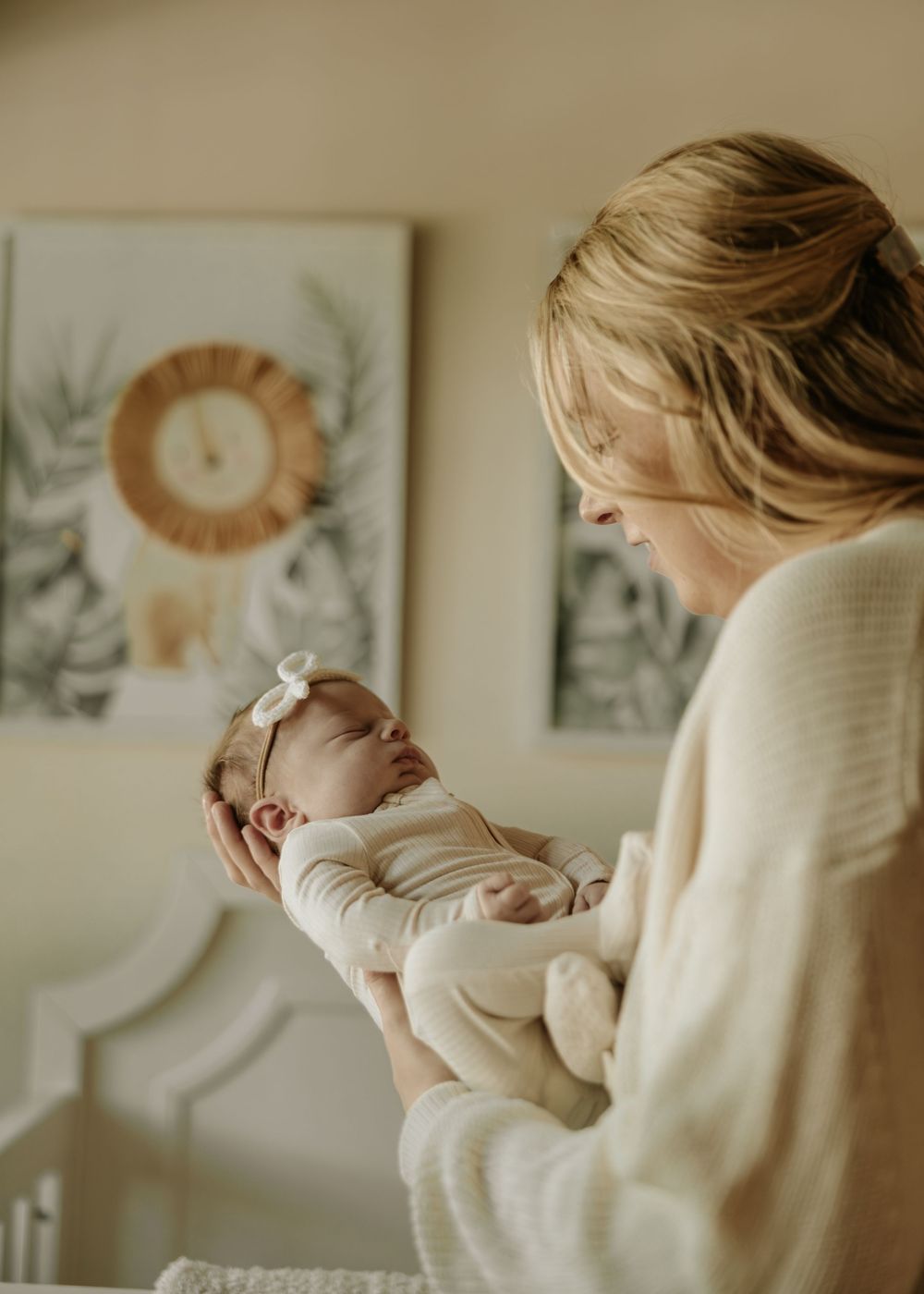 Candid indoor moments showing a family bonding session in warm lighting and cozy atmosphere.