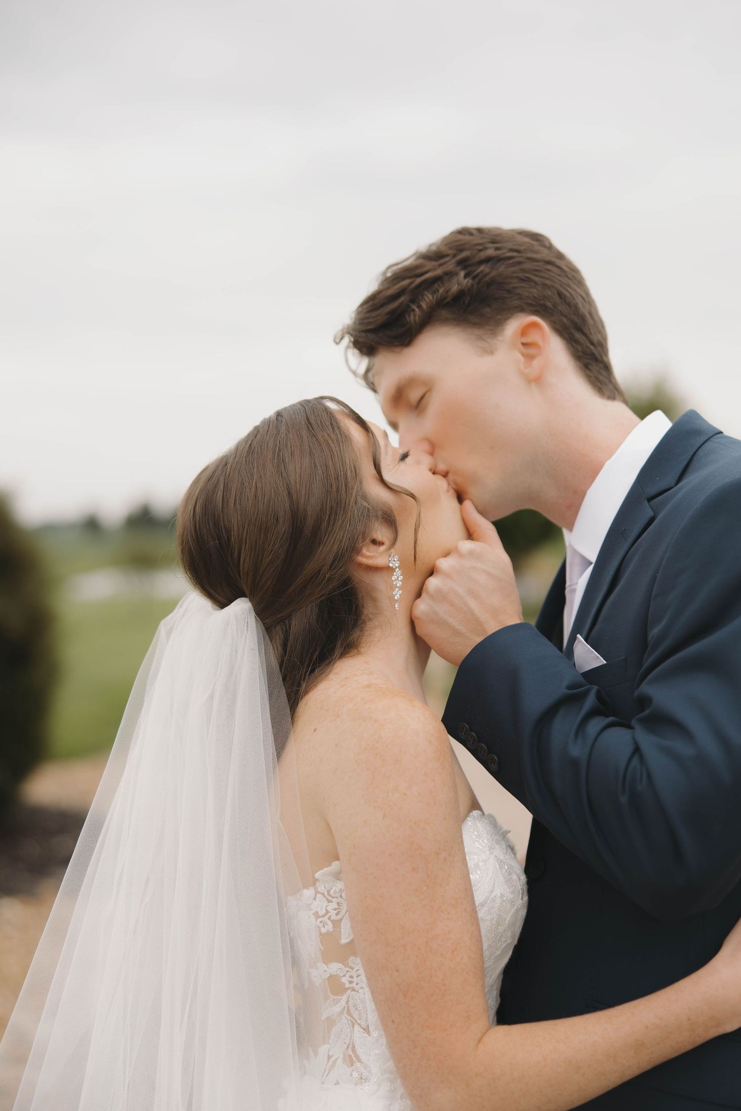Bride and groom share intimate kisses during their wedding photoshoot in a series of romantic close-up shots.