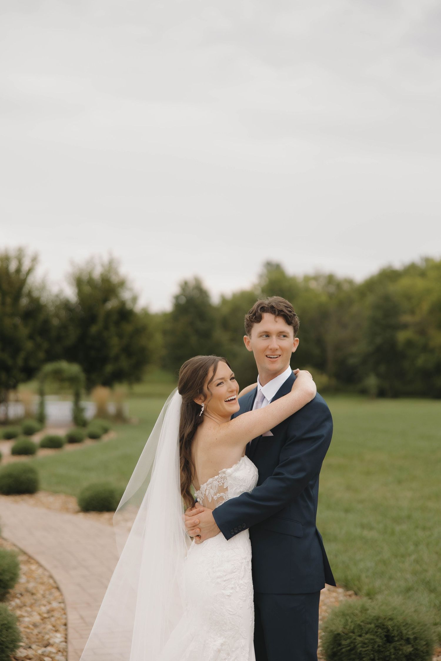 A romantic wedding sequence shows the couple embracing in a grassy outdoor setting.