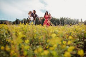 Family photo in a flowers by Kristy Baker Photography, a local Steamboat Springs, Colorado photographer.