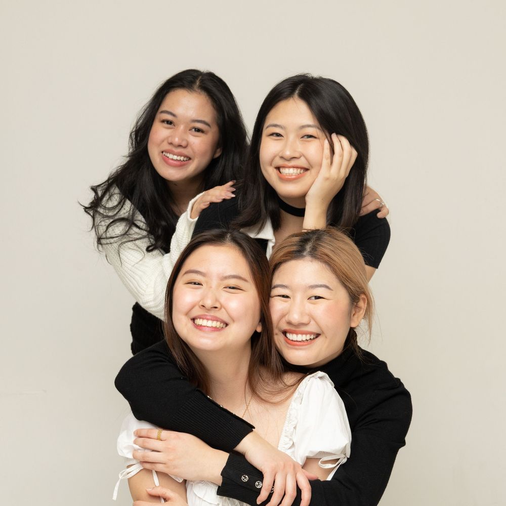 Professional black and white portrait series showing joyful candid moments between two people on white background.