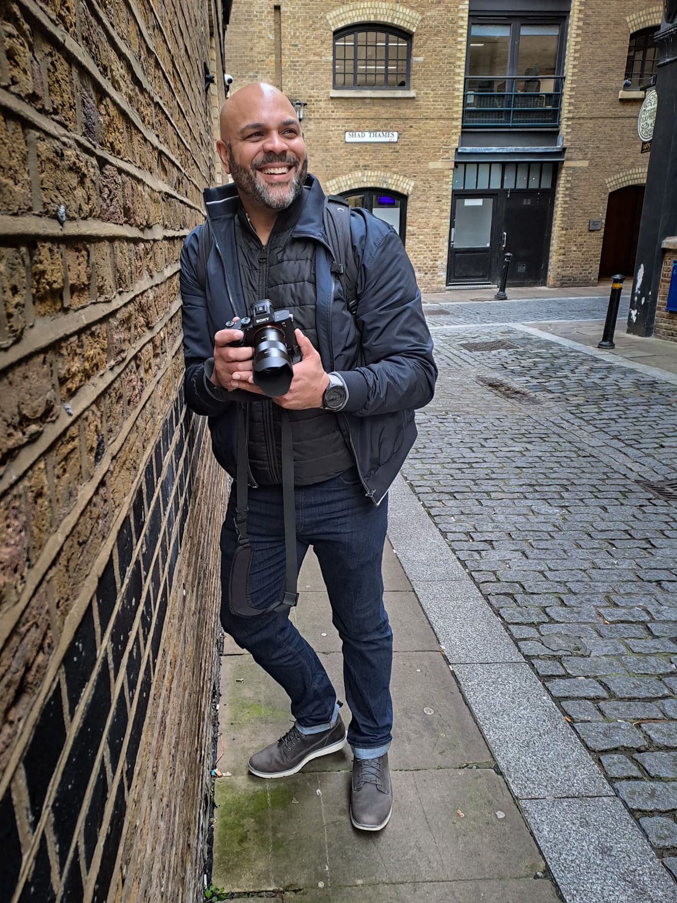 Steve Currie a personal branding photographer in London leans on a wall during a  branding photoshoot in Central London
