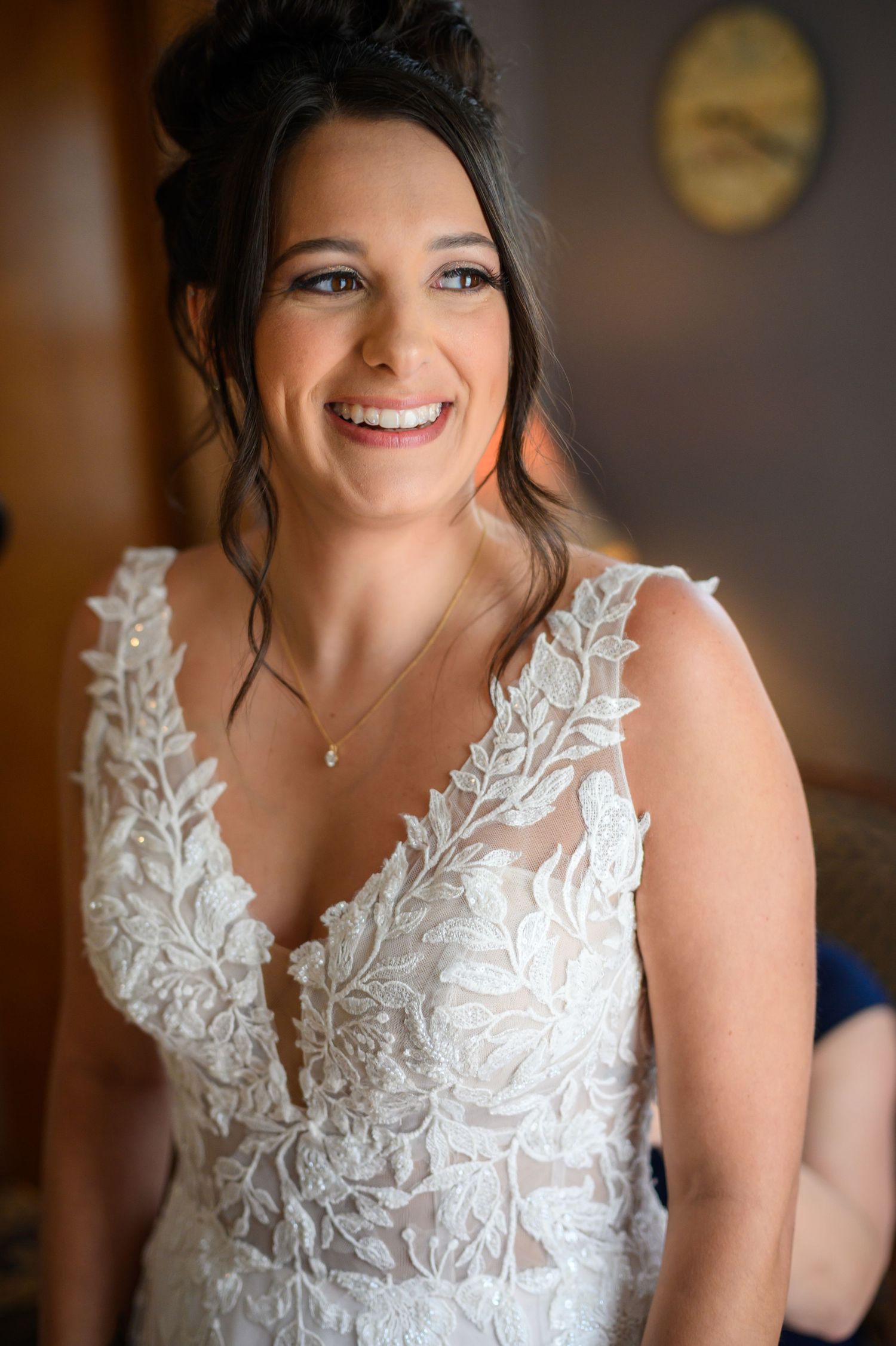 Delicate lace details and beading adorn a romantic wedding gown bodice in elegant close-up shots.