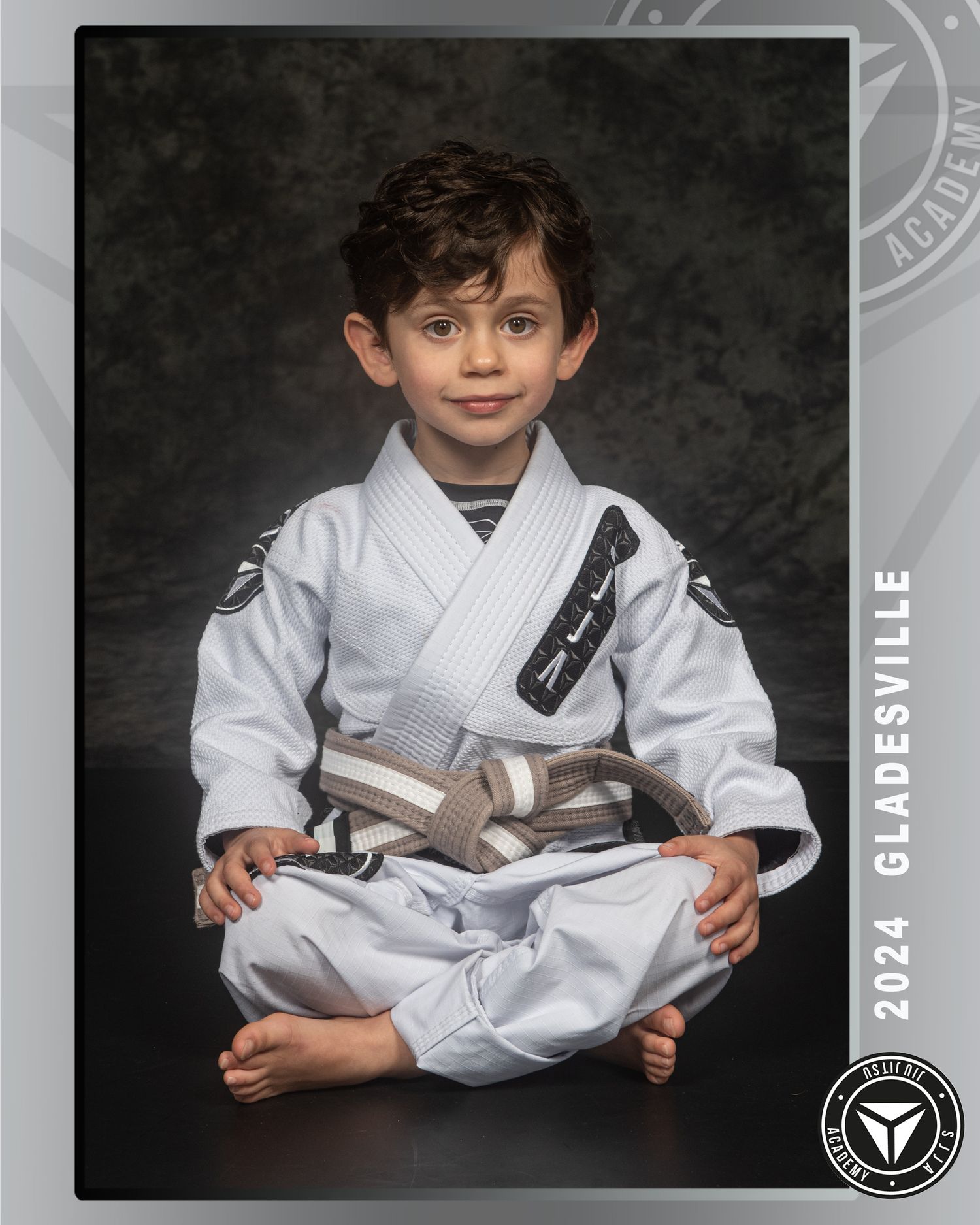 Young martial arts student in white gi demonstrating technique.