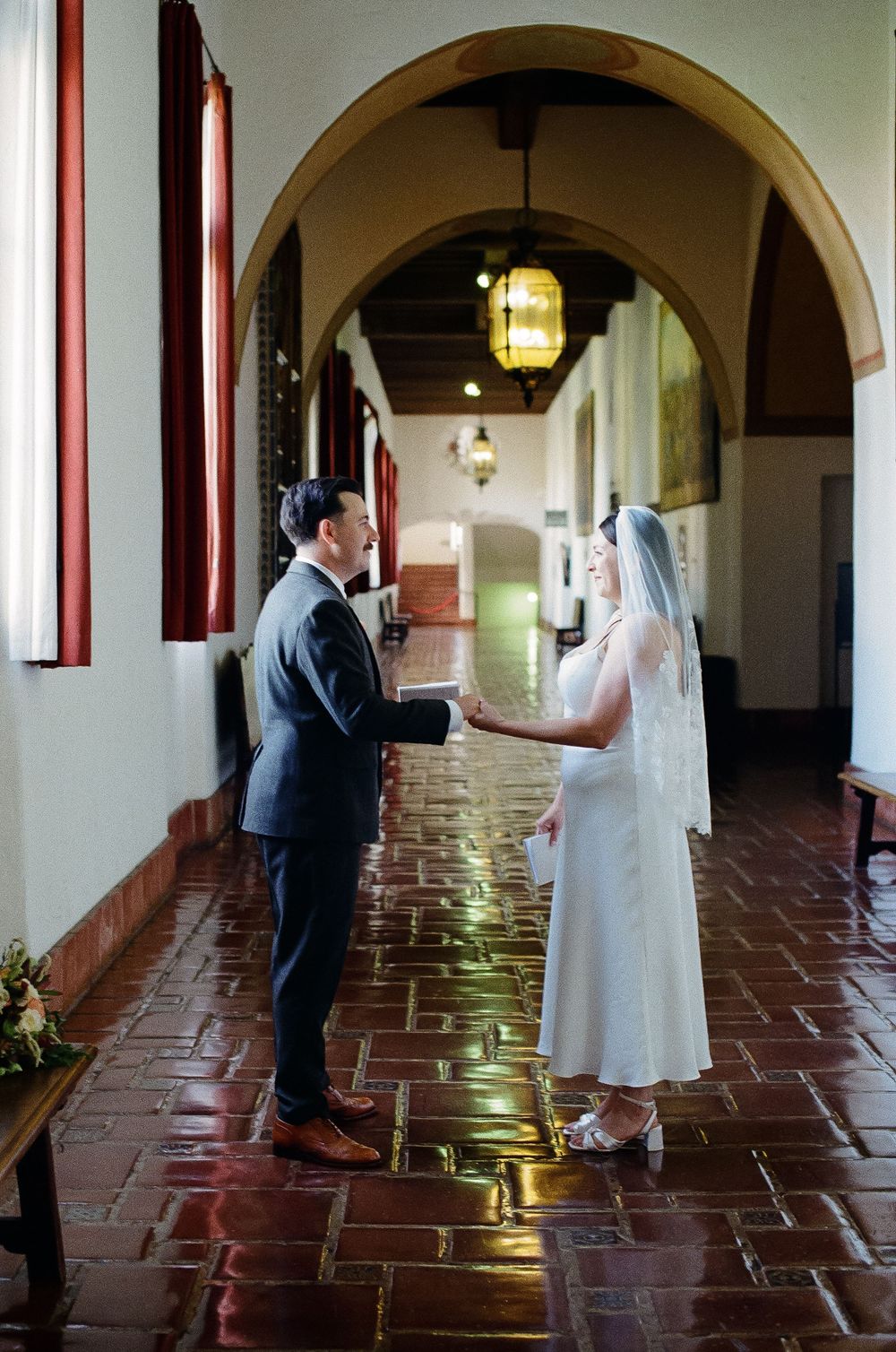 Groom reading personal vows before Mural Room ceremony on 35mm film