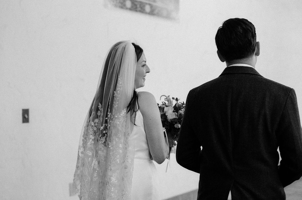 Romantic wedding portrait on courthouse steps in Santa Barbara.