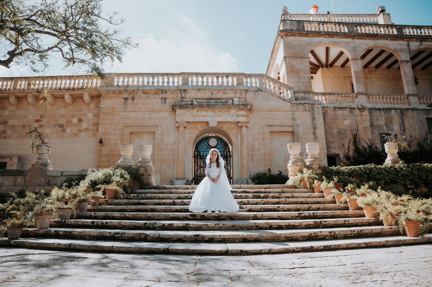 Panoramic view of stone staircase and architecture at elegant outdoor venue.